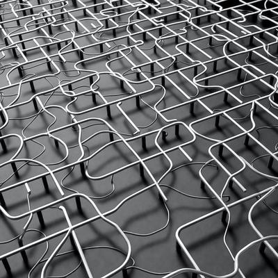 The primary subject of the image is a close-up of a metal grid or a patterned surface, which appears to be a metal mesh or a woven metal. The setting is a black background, which contrasts with the metal grid. The visual style is a close-up, which emphasizes the details of the metal grid. The colors and mood of the image are predominantly black and white, giving it a modern and minimalist appearance.